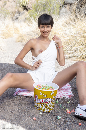 This tanned brunette poses nude with elegance, exuding warmth and natural sensuality 03 pics