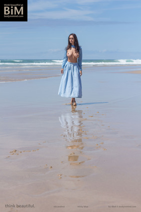 Ela Andrea poses gracefully in a dreamy blue atmosphere, glowing with delicate beauty 00 pics