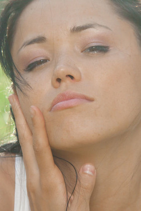 Elegant model Elvia T gracefully tearing her t-shirt in a seductive pose. 07 pics